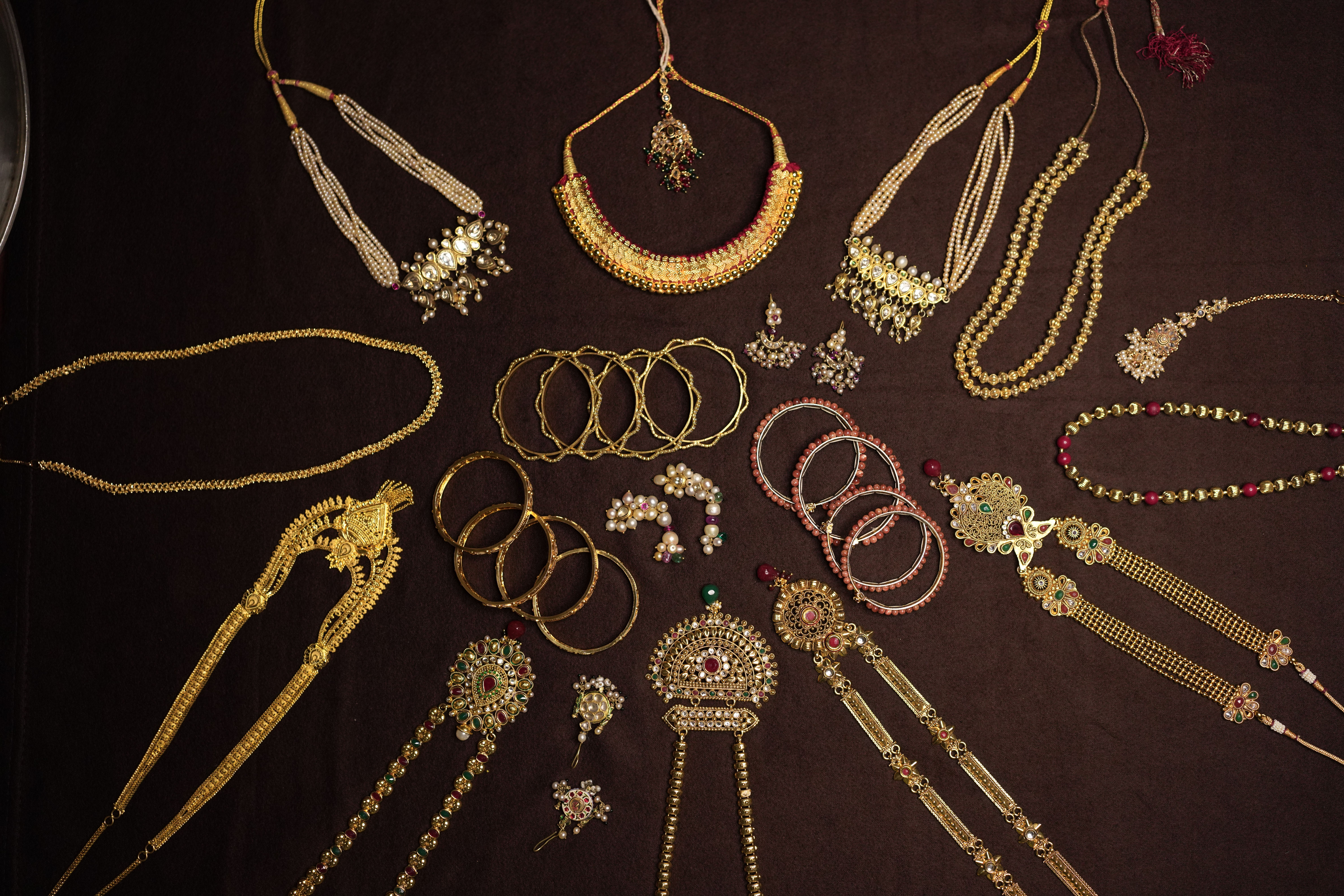 Exquisite display of traditional Indian gold necklaces, bangles, and earrings