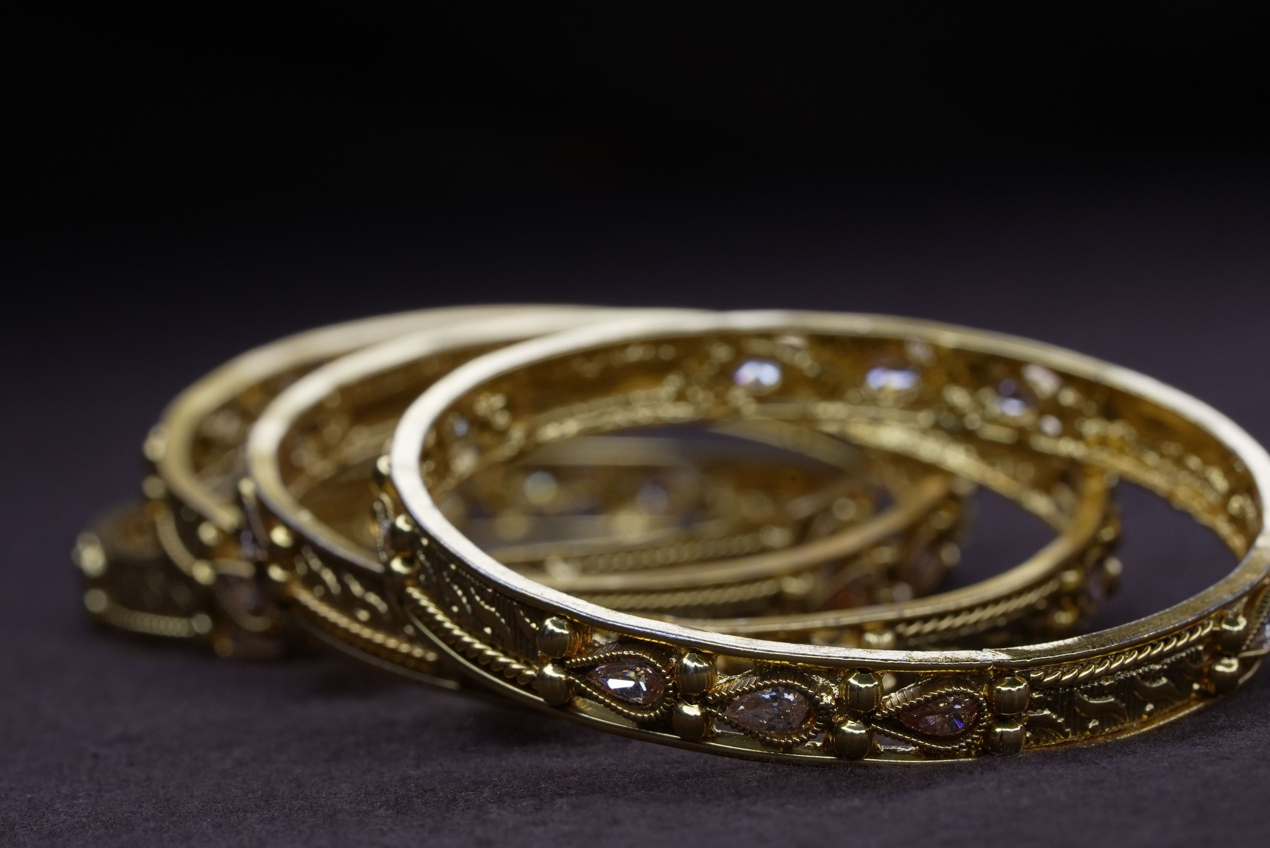 Repoussé Gold and Ruby-Accent Kadais close-up