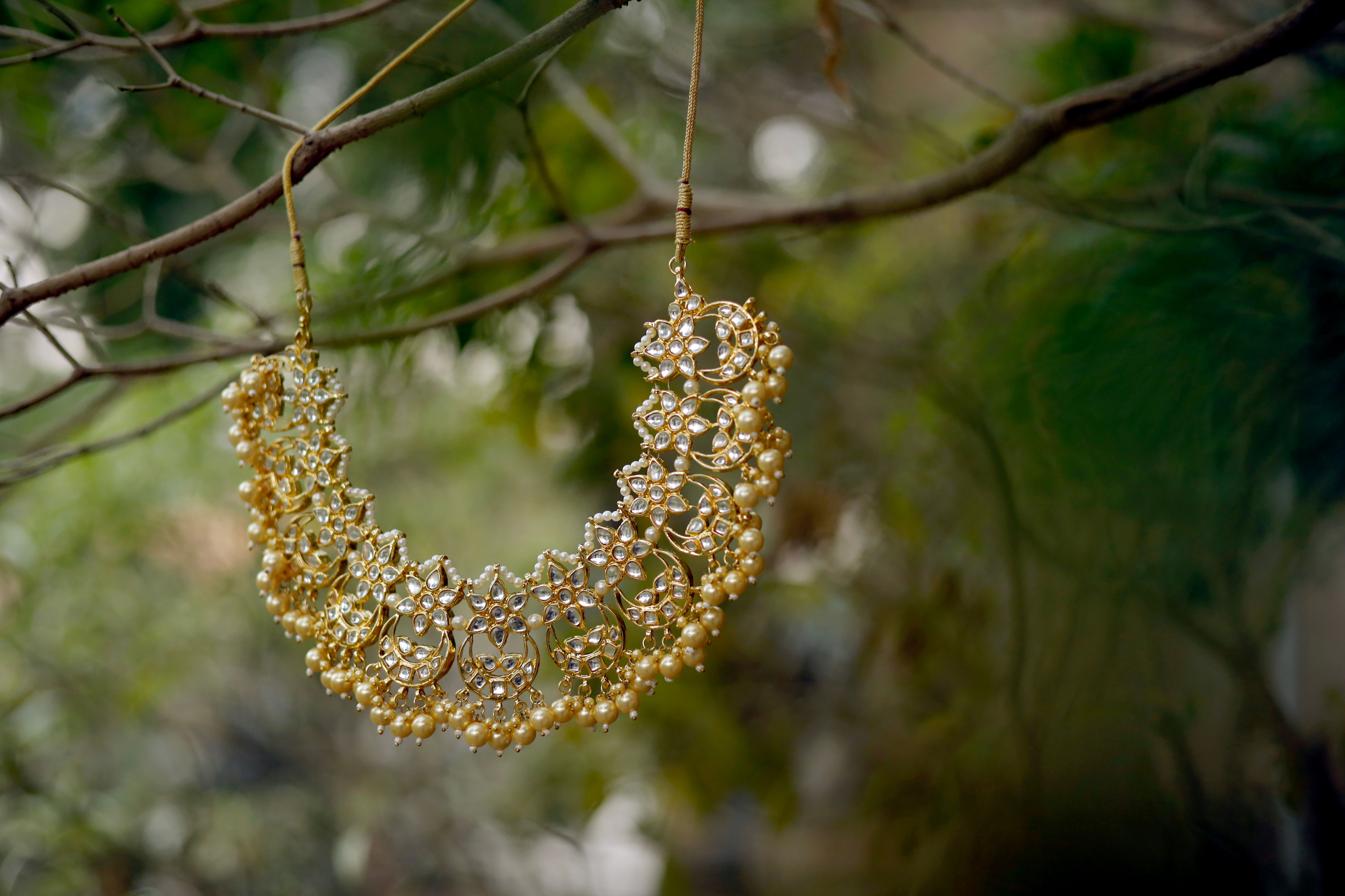 Bridal pearl-clustered temple gold necklace